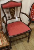 An Edwardian inlaid mahogany elbow chair