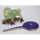 A hardstone Chinese lion and enamel mirror