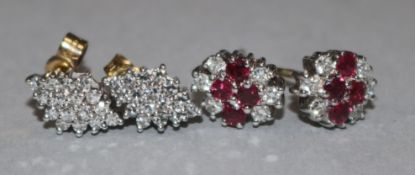 A pair of ruby and diamond cluster earrings; and a pair of lozenge-shaped diamond cluster