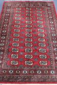 A red ground Bokhara style rug, 185 x 125cm