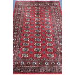 A red ground Bokhara style rug, 185 x 125cm