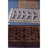 A Bokhara rug and two others, 110 x 75cm, 140 x 80cm & 125 x 70cm