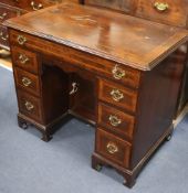 A George II style walnut & feather banded kneehole desk