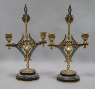 A pair of 19th century French ormolu and champleve candelabra