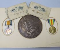 A pair of 1st World War medals and a death plaque to Pvt. H Maclean and two memorium cards with