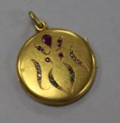 An Edwardian yellow metal (tests as 18ct) and gem set pendant locket, 25mm.