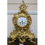 A Louis XV style gilt brass eight day mantel clock