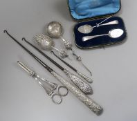 A cased pair of silver preserve spoons, a pair of silver grape shears, two German silver spoons,