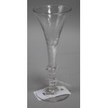 A wine glass, c.1750, with flared bowl, over a knopped airtwist stem, 6.75in.