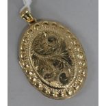 A 1970's engraved 9ct. gold locket, gross 8.6 grams, overall 4.5cm.