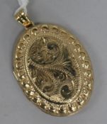 A 1970's engraved 9ct. gold locket, gross 8.6 grams, overall 4.5cm.