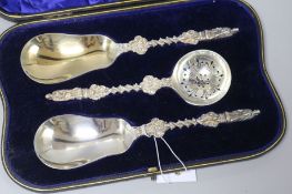 A Victorian cased pair of silver apostle serving spoons and matching sifter spoon by William