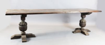 An Elizabethan style oak refectory table, L.275cm