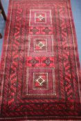 A Caucasian red ground rug, 186 x 107cm