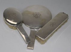 A stylish 1940's Danish silver mounted three piece brush and mirror set by Johannes Siggaard, mirror