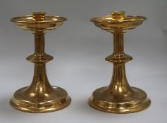 A pair of brass candlesticks