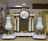 A Louis XVI white marble clock set