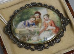 A Victorian miniature of three young girls with rabbits, in a polished steel frame, 7cm.