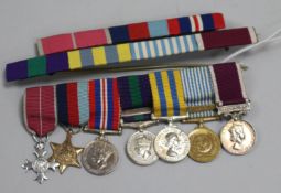 A group of miniature medals with ribbon bars