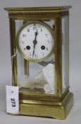 A French brass four glass clock