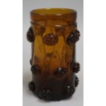 A Rheinish amber glass humpen, decorated with "raspberry prunts", 5.75in.