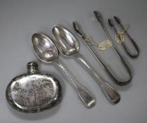 A Victorian silver spirit flask, two silver spoons and two pairs of sugar tongs.