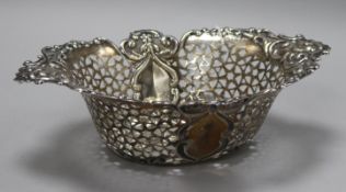 An Edwardian pieced repousse silver fruit bowl decorated with masks and scrolls, Walker & Hall,