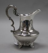 A William IV silver cream jug, with scroll handle, on scroll feet, The Barnards, London, 1835,