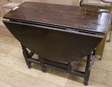 A late 17th century oak oval topped gateleg table, on turned supports, W.99cm
