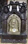 A Chinese bronze bell with hardwood frame