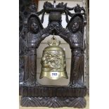 A Chinese bronze bell with hardwood frame