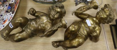 A pair of cherub wall lights