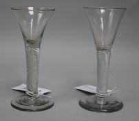 A near pair of ale glasses, c.1750, with flared bowls over air twist stems, 6in.