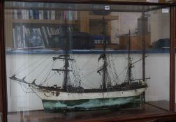 A well detailed 19th century model of a trading schooner, in its mahogany glazed display case,