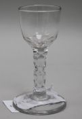 A wine glass, c.1785, with round bowl over a faceted stem, 4.75in.