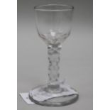 A wine glass, c.1785, with round bowl over a faceted stem, 4.75in.