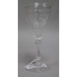 A tall etched wine glass, with ogee bowl and knopped stem, all over scrolling foliate, 8.25in.