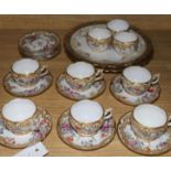 A set of nine Dresden coffee cups and saucers and two Limoges plates