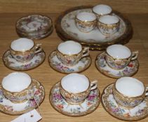 A set of nine Dresden coffee cups and saucers and two Limoges plates