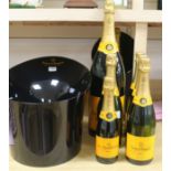 An advertising Veuve Clicquot champagne bottles and ice buckets
