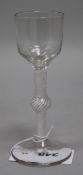 A wine glass, c.1765, with funnel bowl, knopped opaque twist stem, 6.5in.