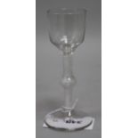 A wine glass, c.1765, with funnel bowl, knopped opaque twist stem, 6.5in.