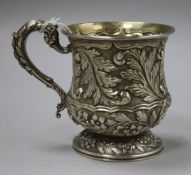 A William IV silver baluster-shaped Christening mug, embossed with flowers and leaves, London