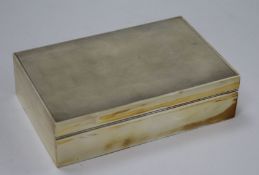 An early 1950's Asprey & Co engine turned silver rectangular cigarette box, 14cm.