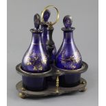 A Regency gilt and blue glass three bottle decanter stand, some wear