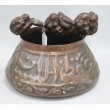 An Isnik copper pot and a hardwood carving