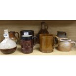 A staved oak grain measure, six various earthenware jugs, mugs, a vase and a 17th century saltglazed