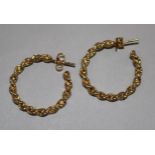 A pair of yellow metal rope-twist hoop earrings