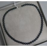A 1980's single strand cultured Tahitian pearl necklace with 9ct white gold clasp, 44cm.