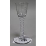 A wine glass, c.1770, with bucket bowl etched with floral sprigs, multi series opaque twist stem,